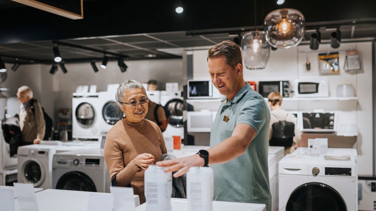 Man Woman in home appliances store