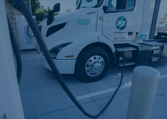 Performance Team Electric truck at Santa Fe Springs warehouse in california parked and charging. 