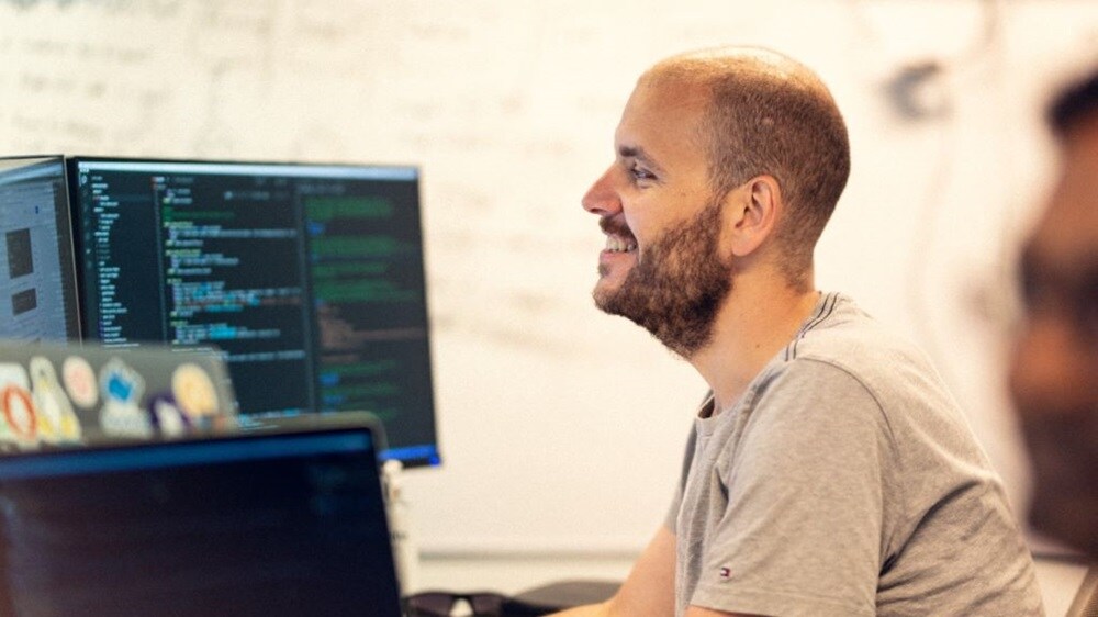 Person working and smiling