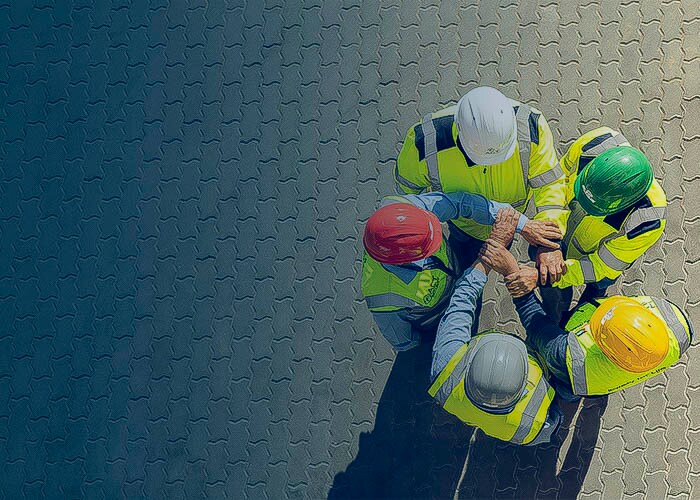 Employees holding hands