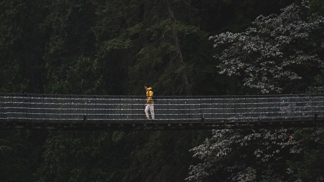 Man walking on bridge