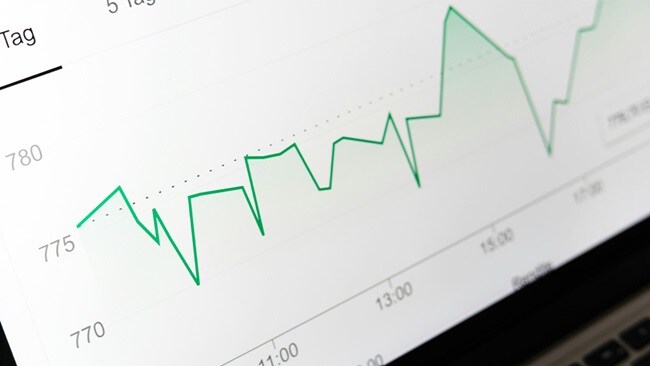 Line graph showing fluctuating data trends over time on a computer screen.