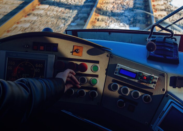 Close up shot of a hand in the cockpit of a plane