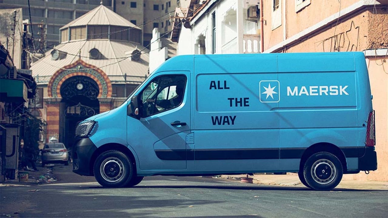 A blue Maersk van on the street