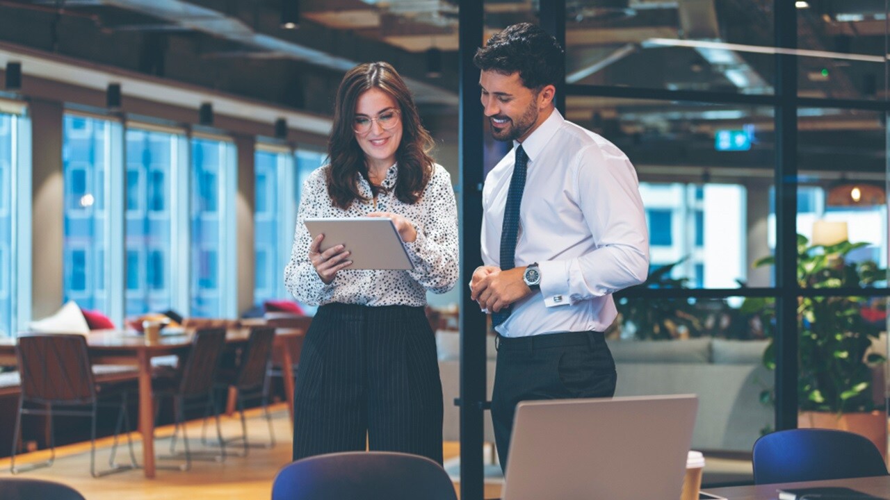 Picture of a man and a woman working on office