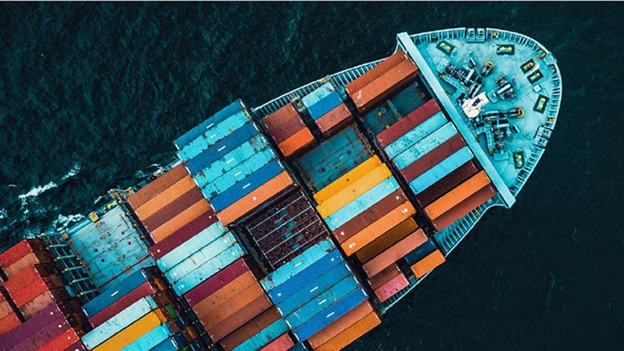 A cargo ship loaded with colorful shipping containers 