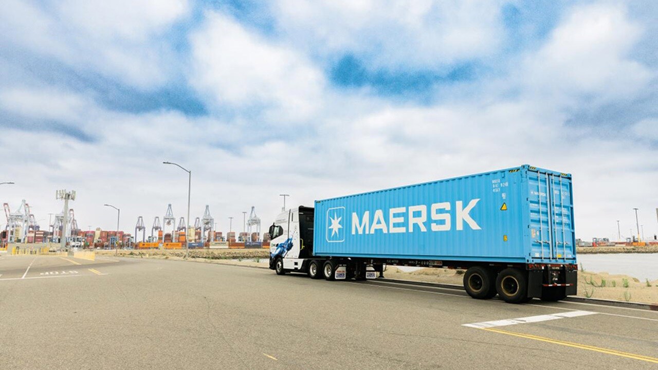 Blue Maersk container on truck arriving at port