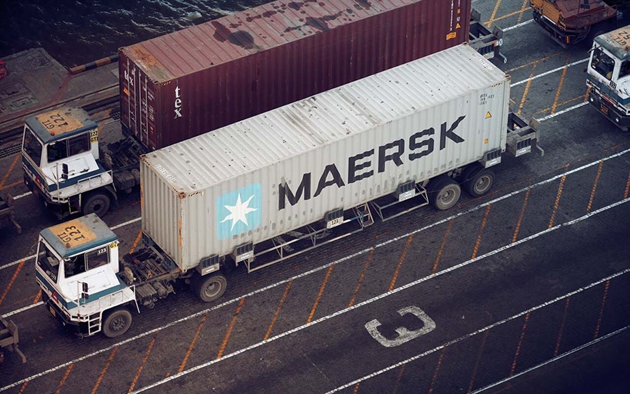 Cargo transportation services - An aerial view couple of trucks with Maersk cargo containers.