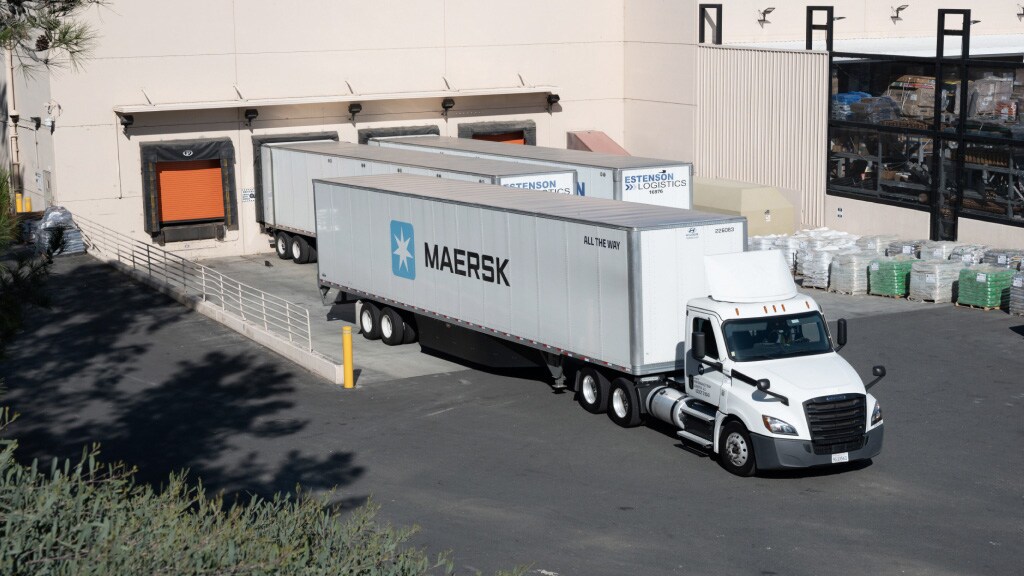 Maersk container trucks parked at the dock warehouse.