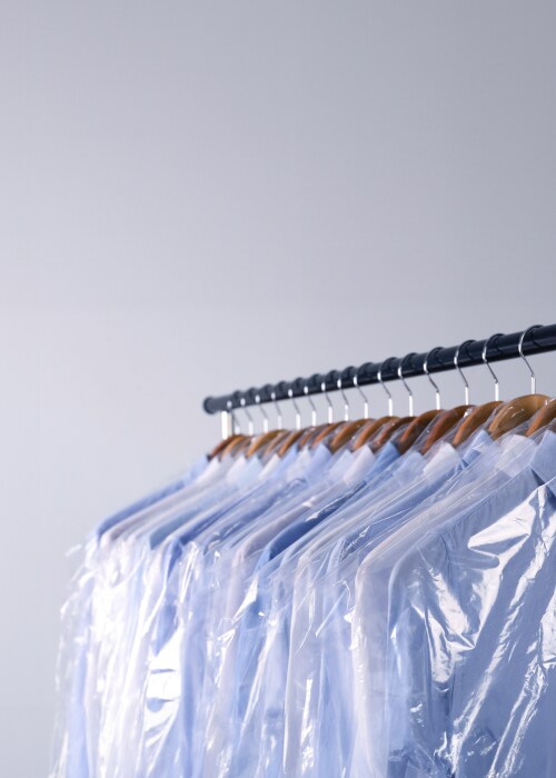 A bunch of shirts hanged on a rack